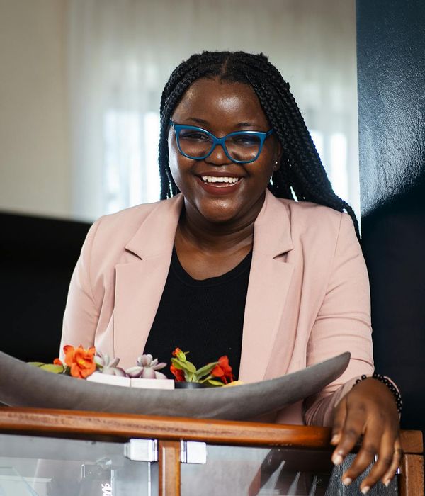 Woman feeling energetic and calm in a bright, open space.